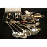 A collection of hallmarked sterling silver and silver plated cutlery to include spoons and ladles.
