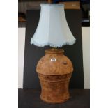 A large Terracotta contemporary lamp with Roman numerals decoration.