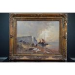 Gilt framed oil painting of a coastal scene with fisherfolk bringing in their catch