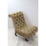 Victorian Button Upholstered Slipper Chair raised on bulbous front legs with castors, 73cms high