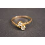 Yellow gold diamond cross over ring