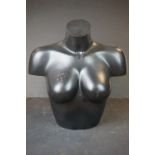 A small mannequin / draper's bust in the form of a ladies torso.