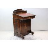 Victorian Rosewood Inlaid Davenport, the lift lid to top opening to a fitted stationery compartment,