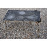 A vintage wrought iron painted coffee table.