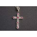 Silver crucifix, inset with semi precious stones, on a silver chain