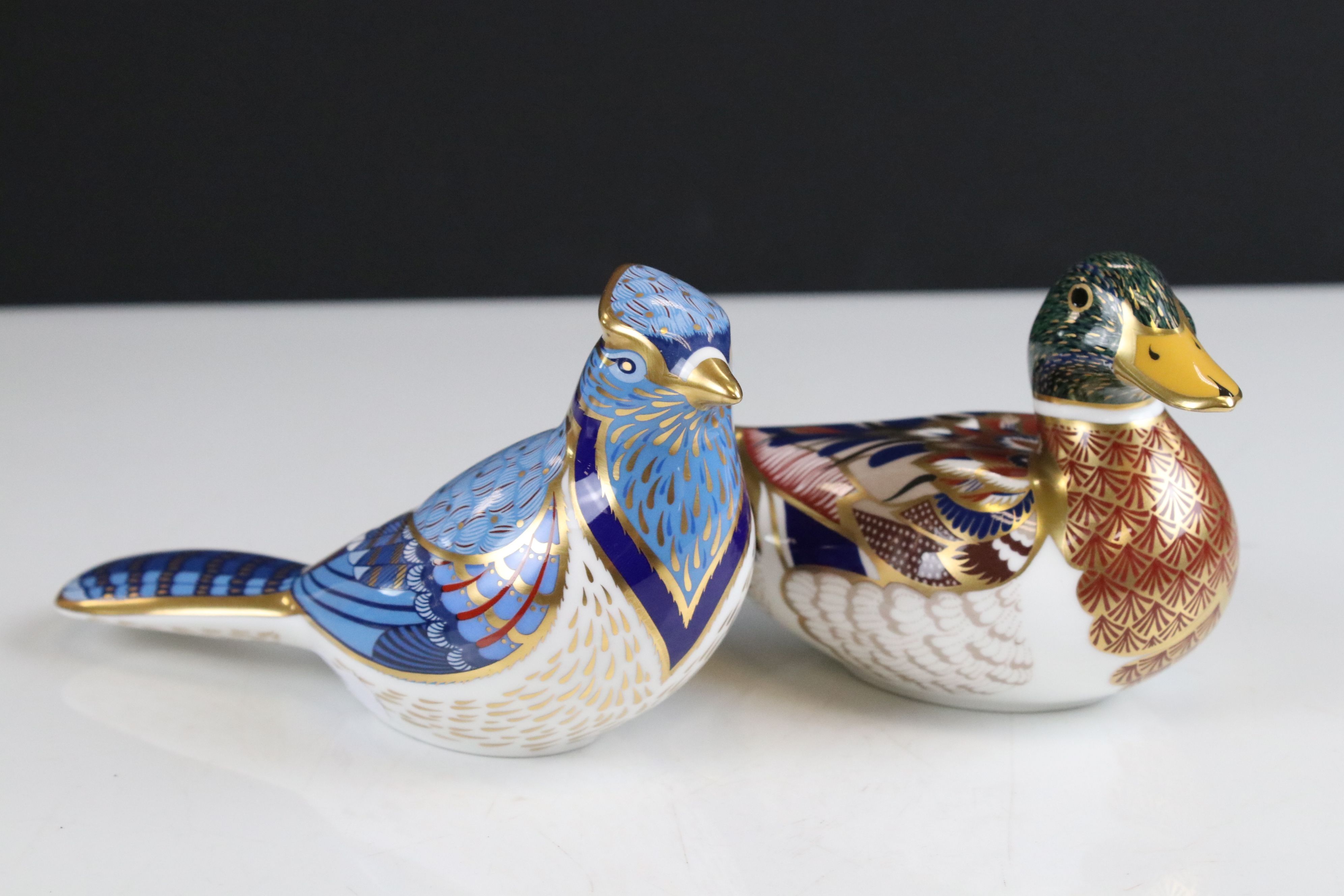 Two Royal Crown Derby Ceramic Paperweights - Mallard Duck (silver stopper) and Blue Jay (gold