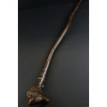 Folk Art Walking Stick, the root pommel carved with a face to one side and a horse head to the