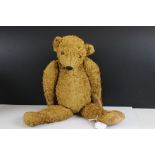 Antique style jointed teddy bear with button eyes and hump