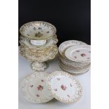 A 19th century ceramic part dinner service with gilt and hand painted floral decoration to include