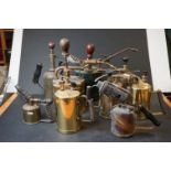 A collection of vintage burners and garden sprayers to include brass examples.
