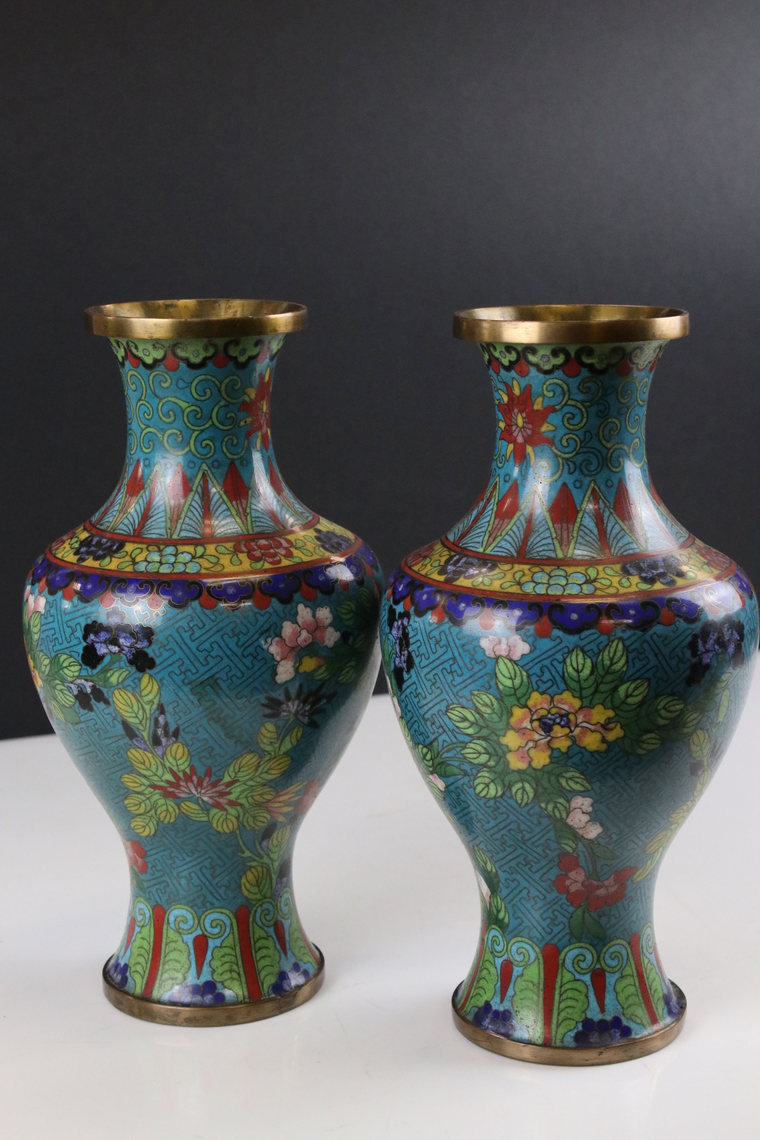 Pair of Chinese Cloisonne Vases decorated with flowers on a turquoise ground, 27cms high