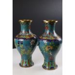 Pair of Chinese Cloisonne Vases decorated with flowers on a turquoise ground, 27cms high