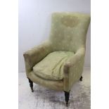 19th century Upholstered Armchair raised on tall turned legs and castors, 94cms high
