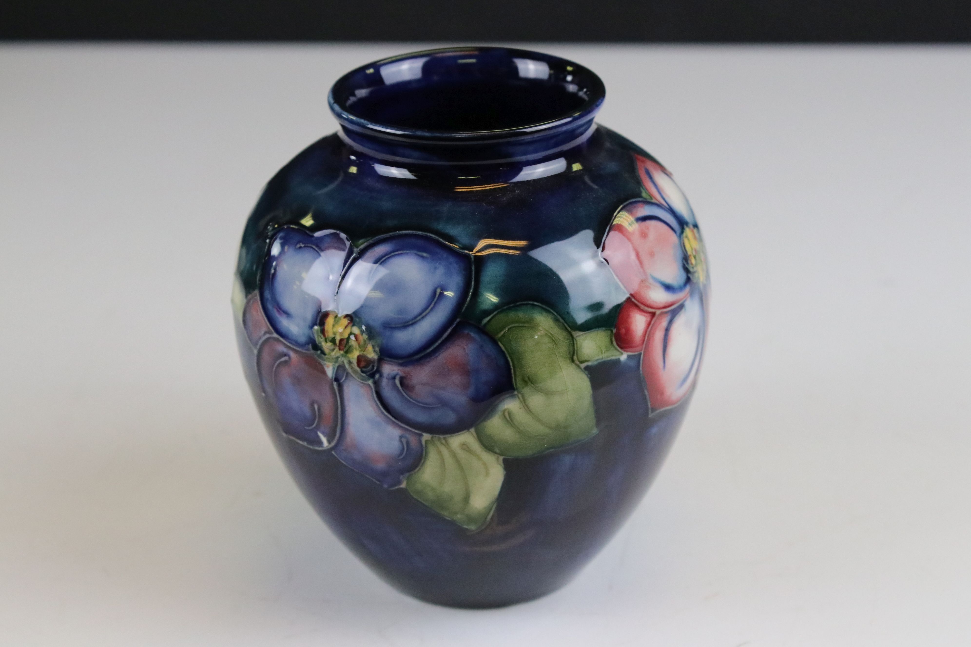 Moorcroft Vase in the Clematis pattern on a blue / green ground, marked to base an impressed - Image 3 of 8