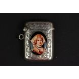 Antique silver vesta case with embossed decoration and enamel plaque