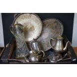 A collection of silver plated items to include trays, jugs, cutlery and a claret jug.