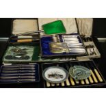 A small collection of cased silver plated cutlery and carving sets together with a small