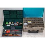 A large quantity of fishing tackle contained within two fishing tackle boxes.