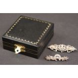 Two early 20th century silver bar brooches, one decorated with hearts and the other with a