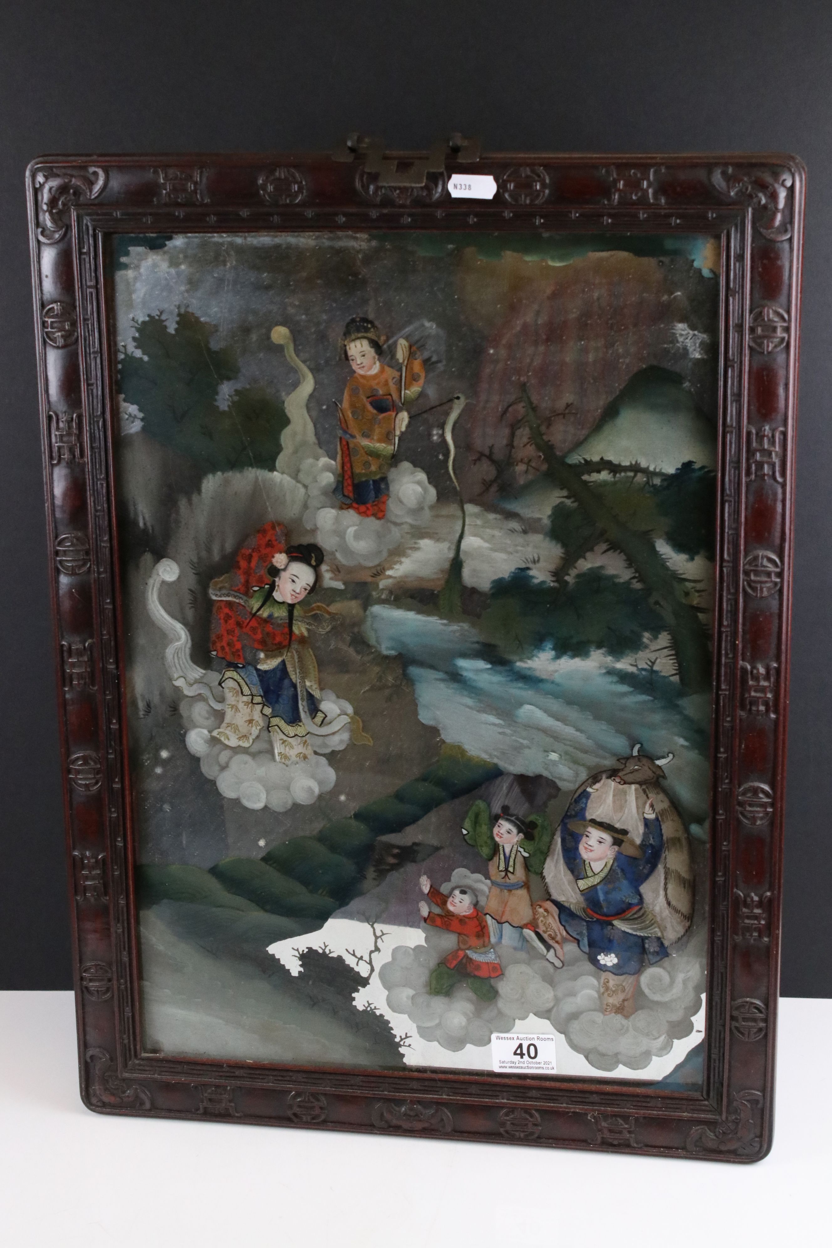 Chinese Reverse Painted Mirror decorated with figures in a landscape floating on clouds contained