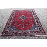 Red & blue ground handwoven Persian Surok carpet, floral medallion design, approx. 320cm x 220cm