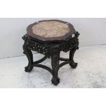 Chinese Hardwood Jardiniere Stand with Marble Inset Top on a Carved and Pierced Base with Lion Masks