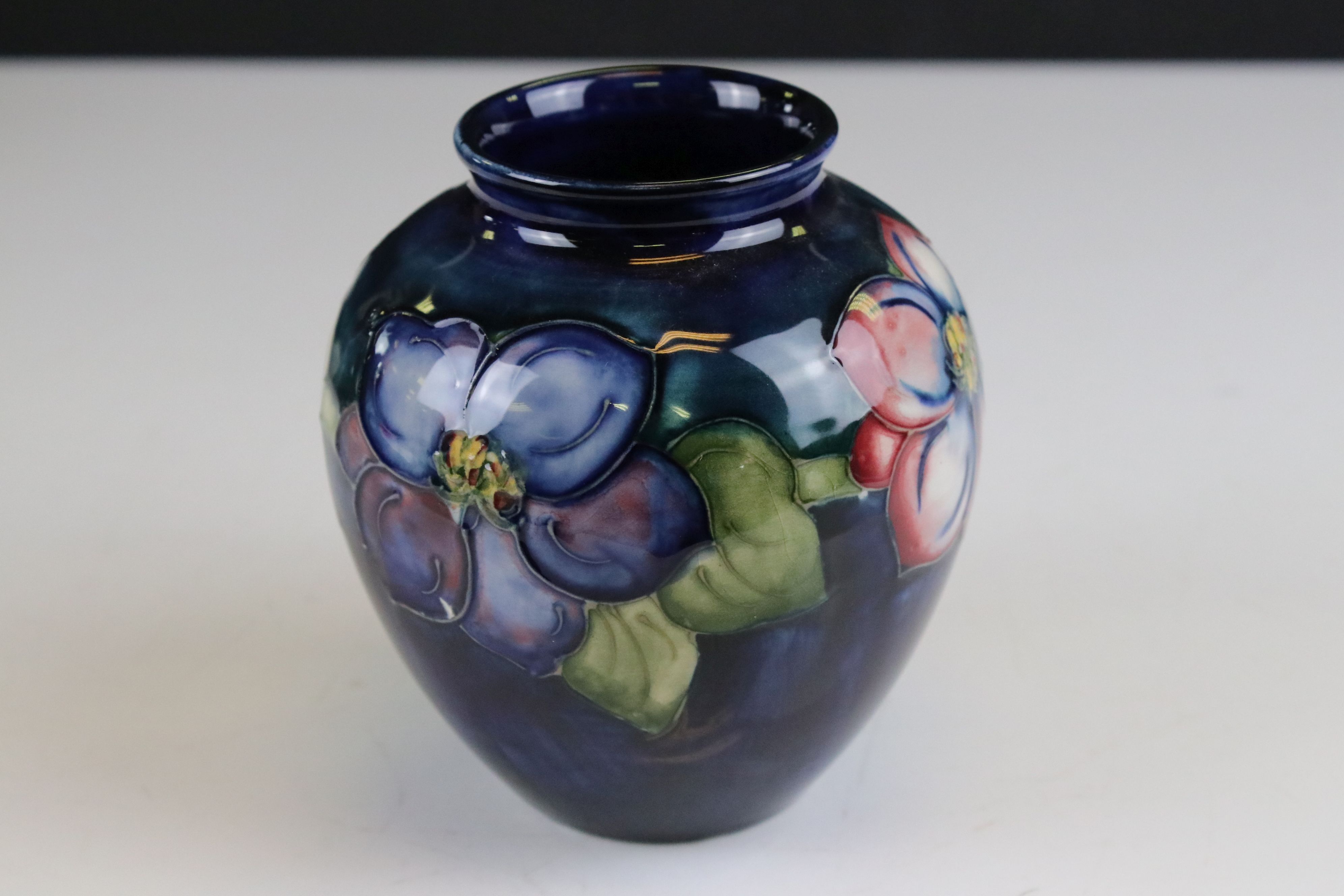 Moorcroft Vase in the Clematis pattern on a blue / green ground, marked to base an impressed - Image 4 of 8
