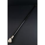 Ebonised Walking Stick, the handle in the form of a Skull with one eye and smoking a cigar, the