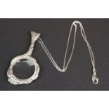 Silver magnifying glass pendant necklace, in the form of a mermaid