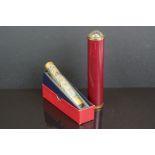 A box brass cased Kaleidoscope with enamel decoration together with another Kaleidoscope.