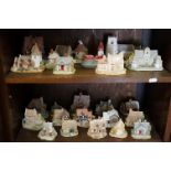 A collection of approx twenty four Lilliput Lane house ornaments.