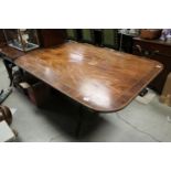 Regency Mahogany and Cross-banded Tilt Rectangular Top Dining Table, raised on a turned central