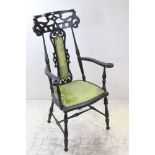 Late 19th / Early 20th century Elbow Chair, the pierced carved back and arms incorporating hearts,