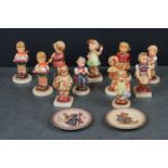 Collection of Eleven Goebel Hummel Figures including Forever Young, Little Helper, A Sweet Offering,