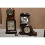 A collection of four vintage wooden cased mantle clocks.