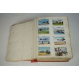 Collection of cigarette cards in a home made 1940s album, to include Players, Wills, Churchman