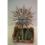 A collection of old antique bottles together with a retro Metamec starburst wall clock.