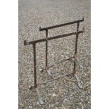 A pair of vintage wrought iron table trestles.