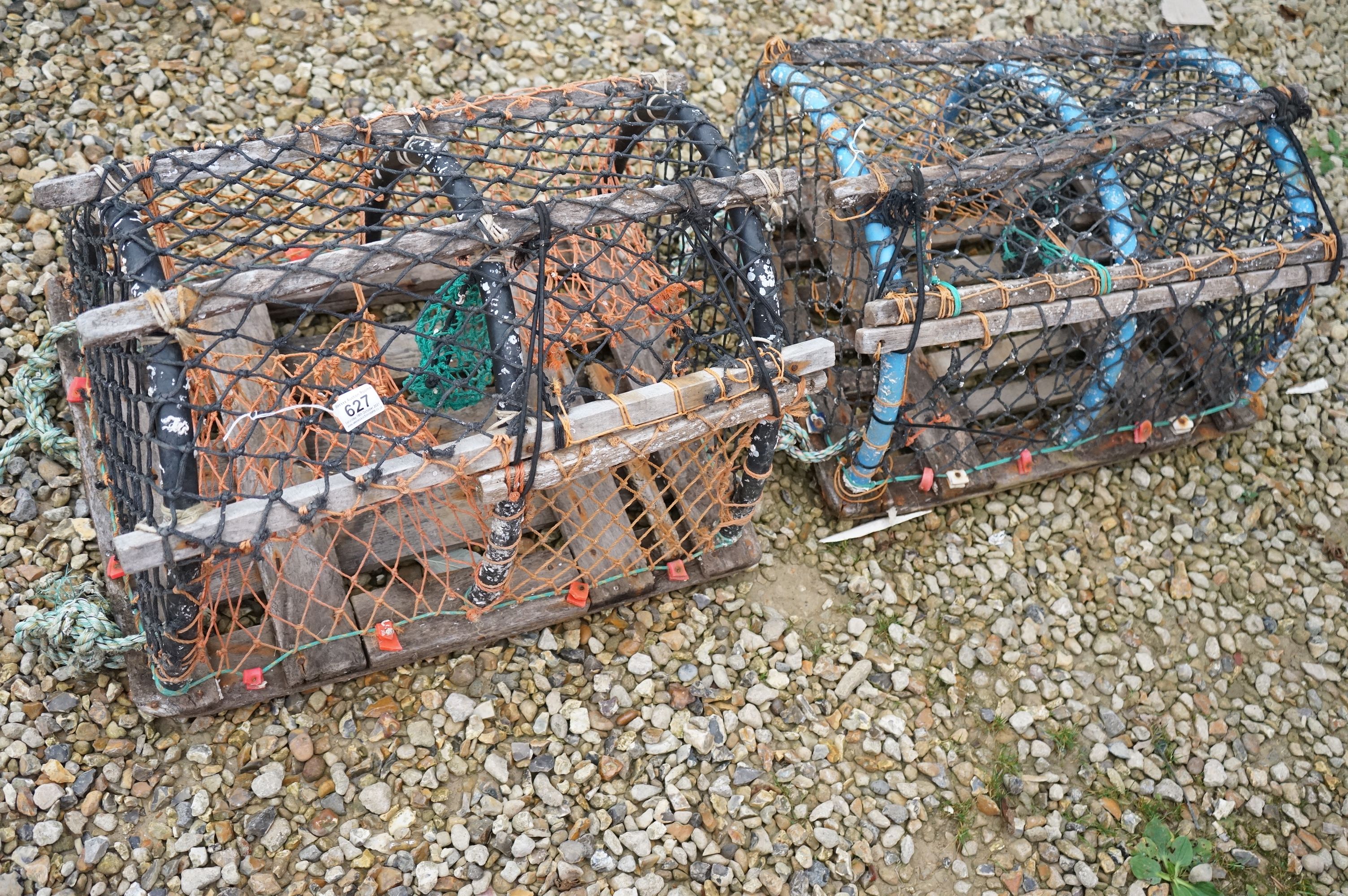 A pair of vintage lobster pots.