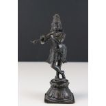 A bronze Hindu figure of Krishna with flute.