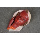 Goldscheider Terracotta miniature face mask, white shawl, brown face.