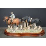 A Border Fine Arts ornament titled "Coming Home" on wooden plinth.