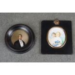 Two framed miniature portraits of a gentleman in formal dress and two young children.