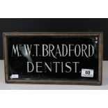 Early to Mid 20th century Glass Dentist Sign ' Mr.W.T. Bradford ' within wooden frame.