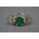 18ct white gold pear shaped emerald and diamond three stone ring