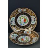 Pair of Continental Porcelain Cabinet Plates having panels decorated with hand painted floral sprays