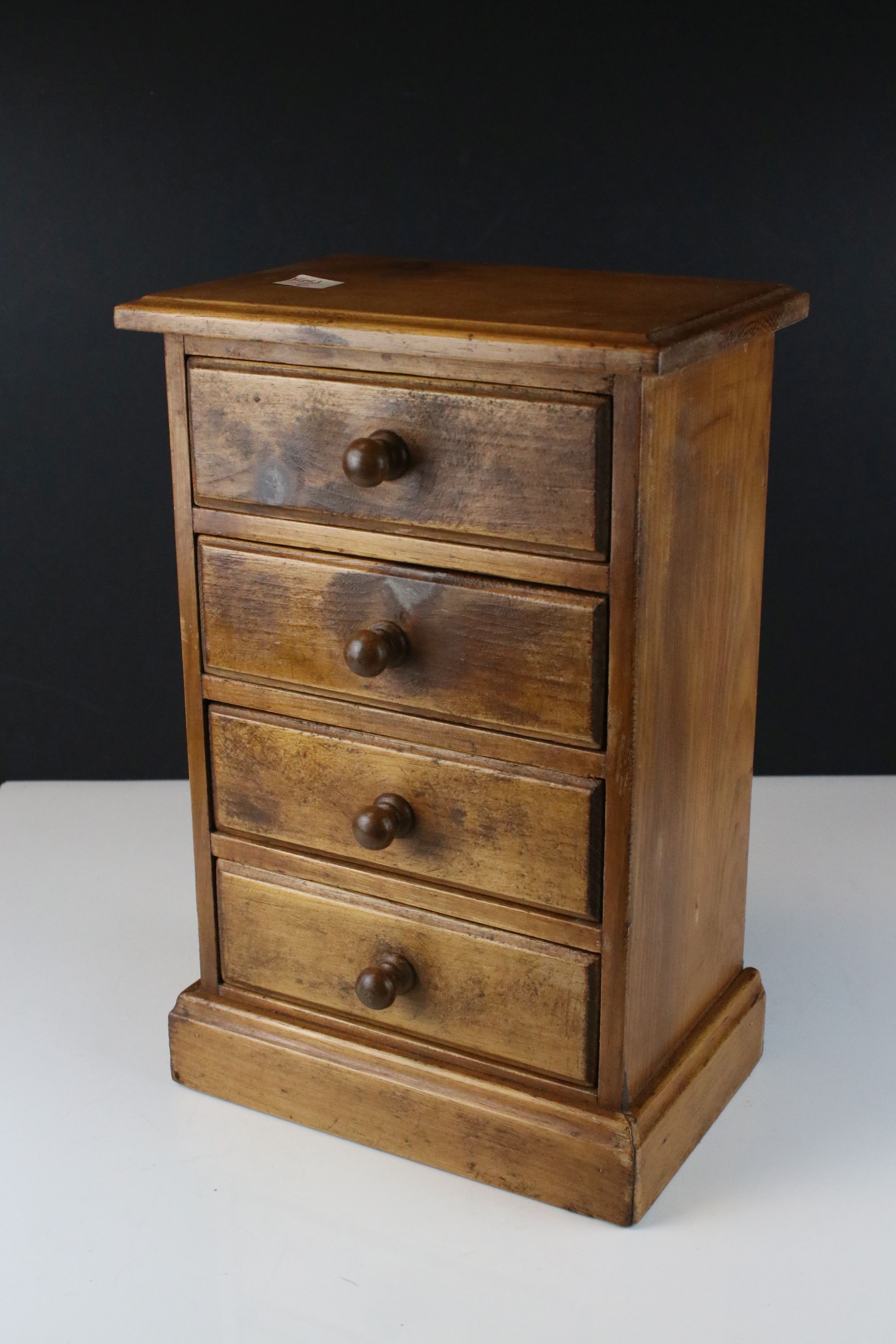 Pine four drawer table top chest