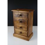 Pine four drawer table top chest