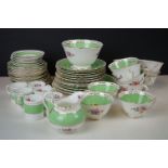 19th century Staffordshire Pottery Tea Service decorated in the New Chelsea Rose pattern with hand