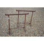 A pair of vintage wrought iron table trestles.